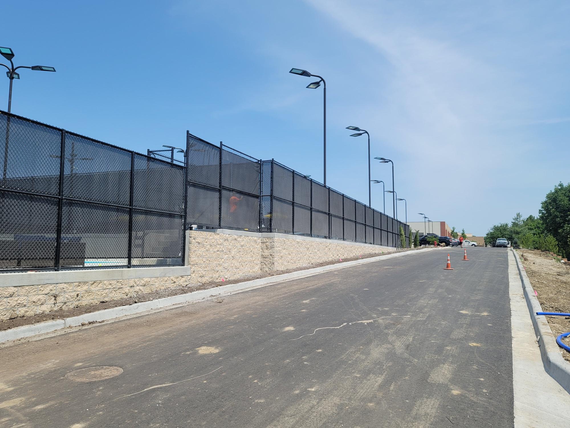 10' tall black vinyl coated chain link fence.